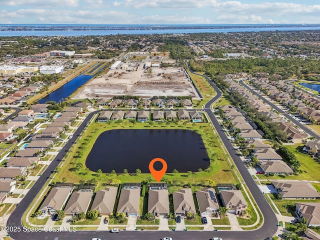 birds eye view of property featuring a water view