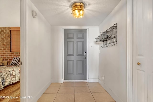 doorway featuring light tile patterned floors