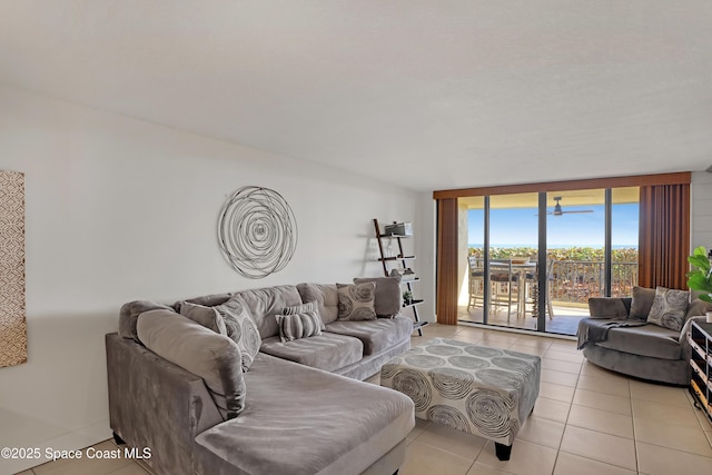 tiled living room with floor to ceiling windows