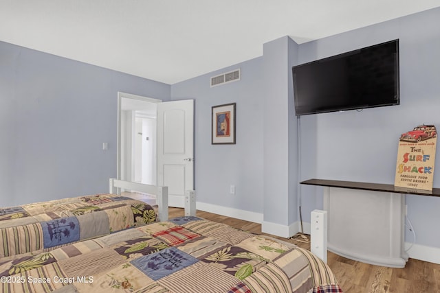 bedroom featuring wood-type flooring