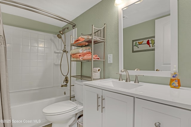 full bathroom with vanity, shower / bath combination with curtain, and toilet