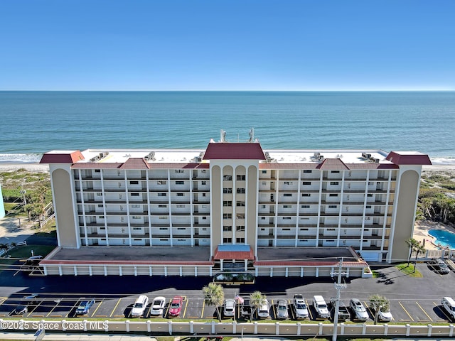 drone / aerial view with a water view and a view of the beach