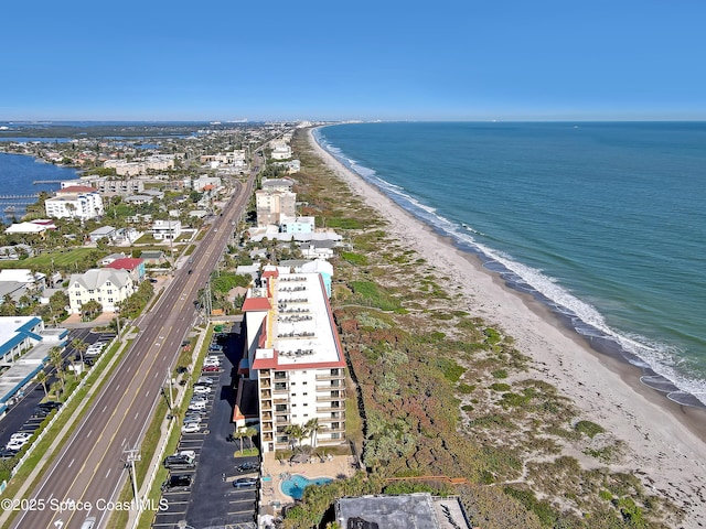 bird's eye view with a view of the beach and a water view