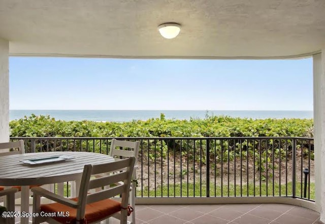 balcony featuring a water view