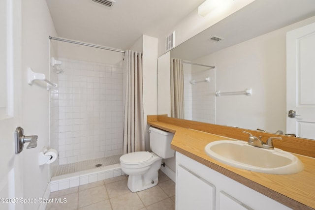 bathroom with tile patterned flooring, vanity, toilet, and curtained shower