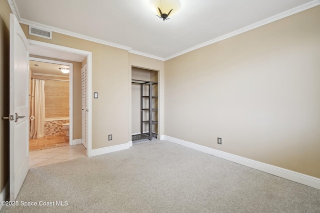 unfurnished bedroom featuring light carpet, a closet, and ornamental molding