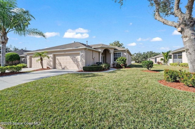 view of front of property featuring a garage and a front yard