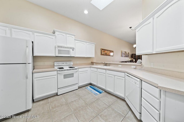 kitchen featuring white appliances, white cabinetry, and sink