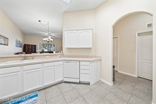 kitchen featuring dishwasher, ceiling fan with notable chandelier, sink, light tile patterned floors, and white cabinetry