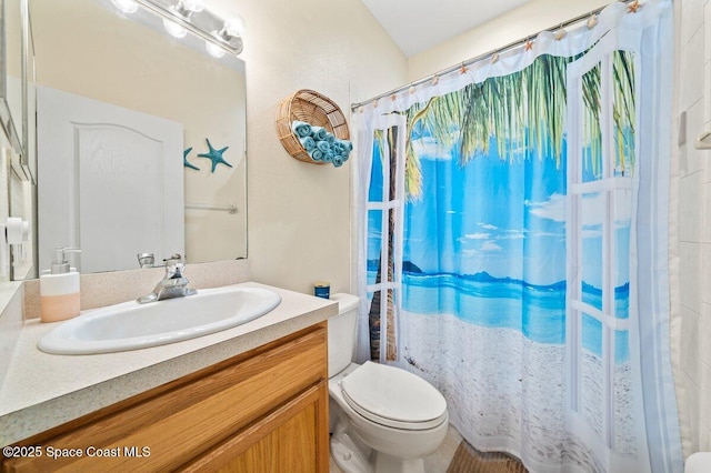 bathroom featuring vanity and toilet