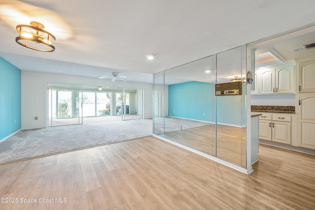 spare room with ceiling fan and light hardwood / wood-style floors