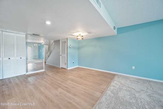 empty room with light hardwood / wood-style flooring