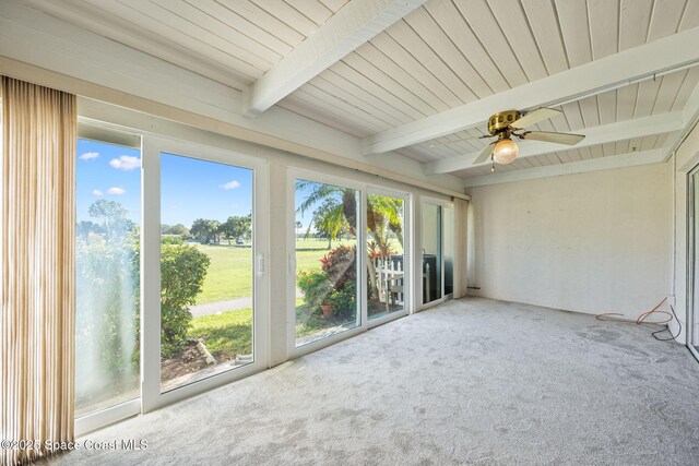 unfurnished sunroom featuring ceiling fan and beam ceiling