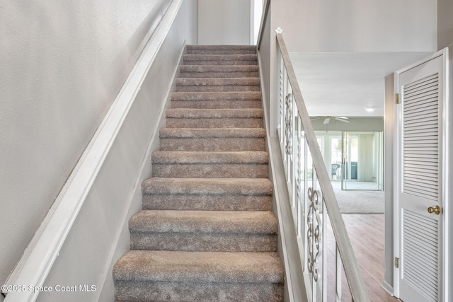 stairway featuring hardwood / wood-style flooring