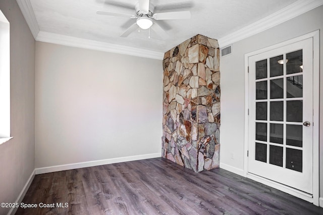 unfurnished room with ornamental molding, ceiling fan, and dark wood-type flooring