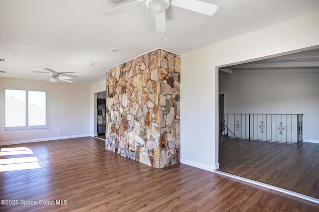 interior space featuring dark hardwood / wood-style floors and ceiling fan