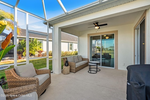 sunroom with ceiling fan