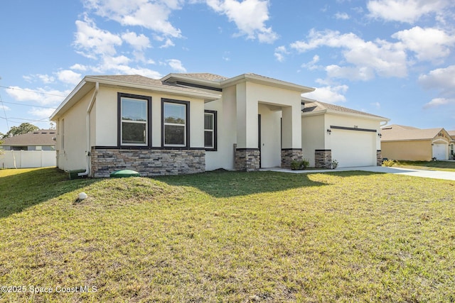 view of front facade featuring a front yard and a garage