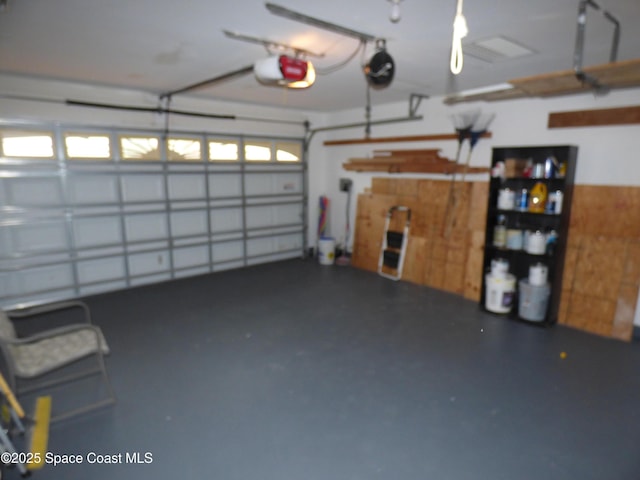 garage featuring a garage door opener