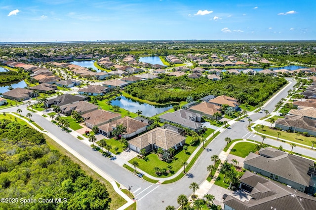 drone / aerial view with a water view