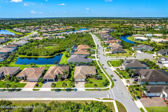 drone / aerial view featuring a water view