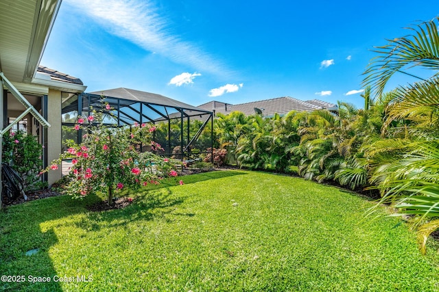 view of yard with a lanai