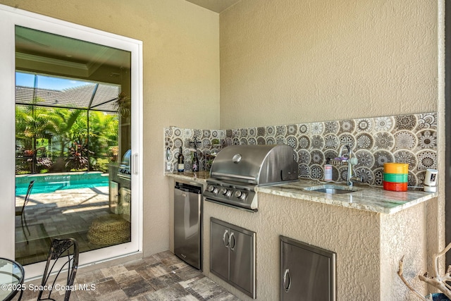 view of patio / terrace with sink and area for grilling