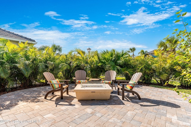 view of patio / terrace with an outdoor fire pit