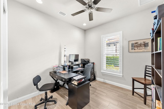 office area with light wood-type flooring and ceiling fan