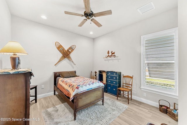 bedroom with ceiling fan and light wood-type flooring