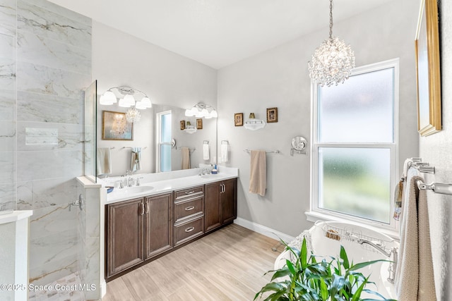 bathroom featuring a wealth of natural light, a shower, wood-type flooring, and vanity