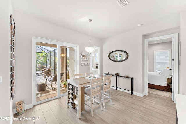 dining area with light wood-type flooring