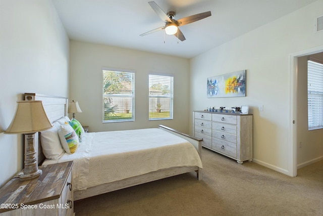 bedroom with light carpet and ceiling fan