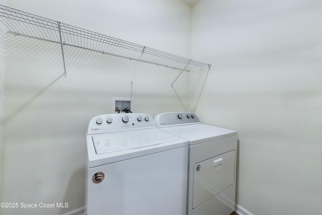 laundry area featuring washing machine and clothes dryer