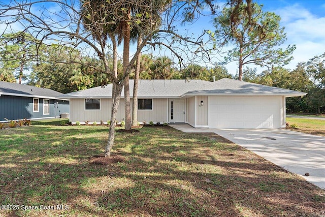 single story home featuring a garage and a front lawn