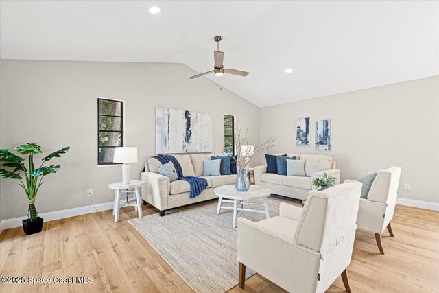 501 Empire Ave NE, Palm Bay, FL 32907 - living room featuring ceiling fan, light hardwood / wood-style floors, and lofted ceiling