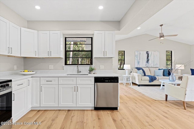 501 Empire Ave NE, Palm Bay, FL 32907 - kitchen with white cabinetry, sink, ceiling fan, and stainless steel dishwasher