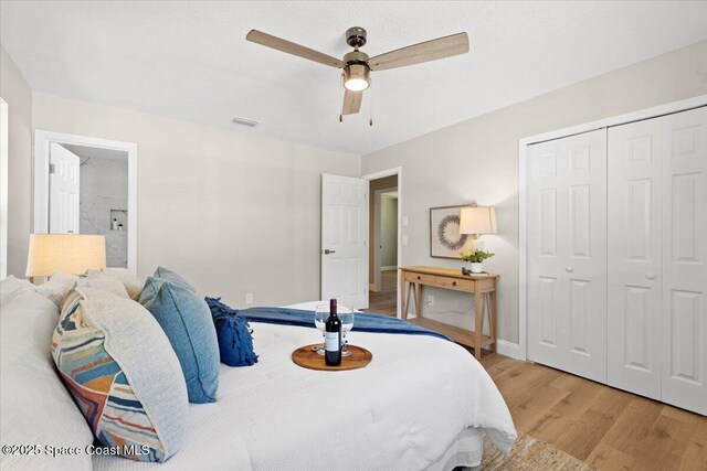 501 Empire Ave NE, Palm Bay, FL 32907 - bedroom featuring a closet, ceiling fan, and light hardwood / wood-style flooring