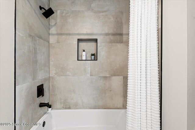501 Empire Ave NE, Palm Bay, FL 32907 - bathroom featuring shower / bath combo with shower curtain