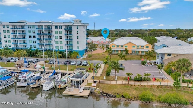 birds eye view of property featuring a water view