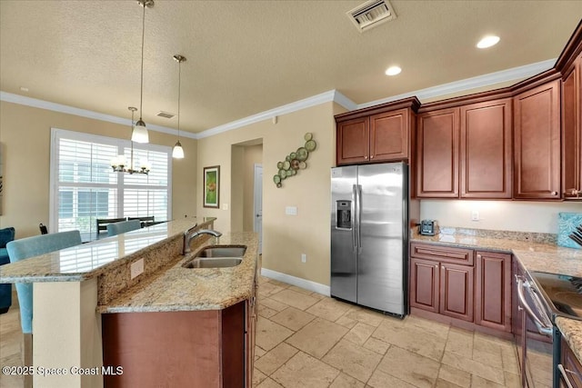 kitchen featuring sink, ornamental molding, decorative light fixtures, and appliances with stainless steel finishes