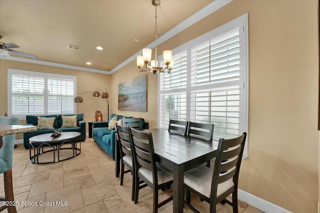 dining area with ceiling fan with notable chandelier and ornamental molding