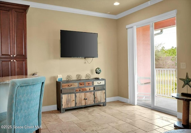 living room featuring a wealth of natural light and ornamental molding