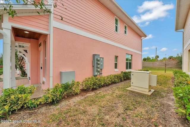 view of property exterior with a yard