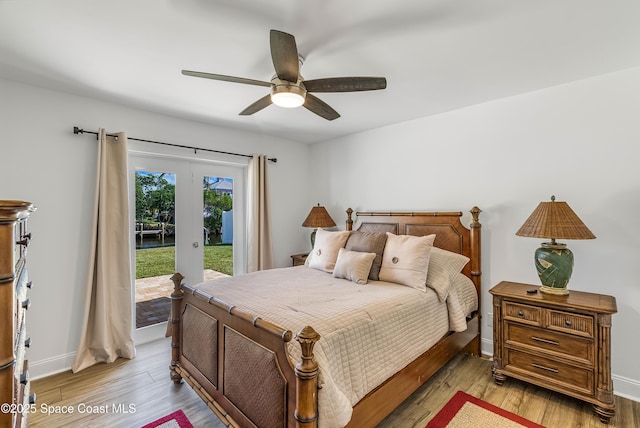 bedroom with access to exterior, ceiling fan, french doors, and light hardwood / wood-style floors