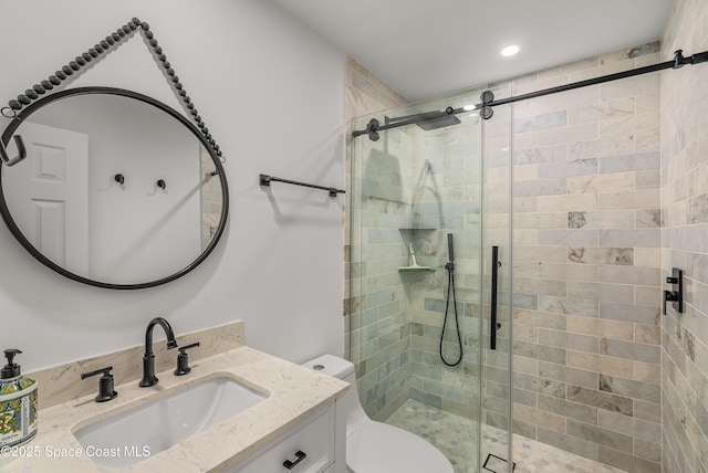 bathroom with vanity, toilet, and an enclosed shower