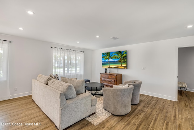 living room with light hardwood / wood-style floors