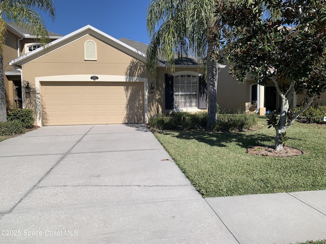 view of front facade with a front lawn and a garage