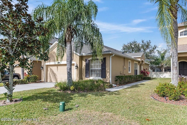 view of front of house with a front lawn and a garage