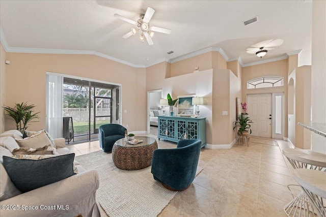 tiled living room with lofted ceiling, ceiling fan, and crown molding